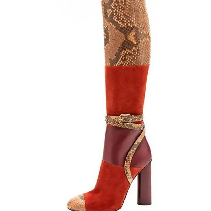 Patchwork snake print knee-high dress boots with a buckle strap and chunky square heel.