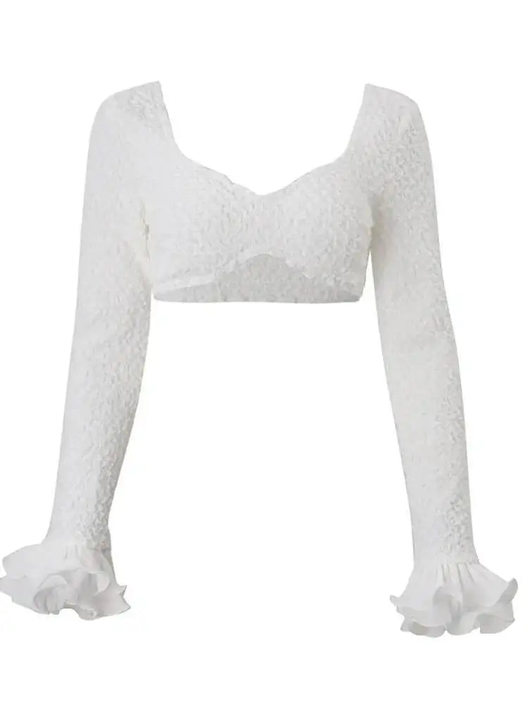 White lace long-sleeve top on a white background
