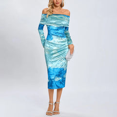 Woman wearing a blue and white patterned dress on a white background