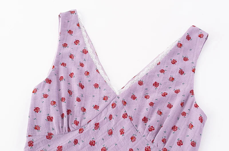 Close-up of the V-neckline and lace trim on the lilac floral midi dress
