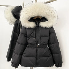 Black puffer jacket with white fur hood on a hanger against a white background