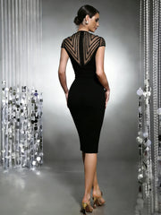 Black sheath midi dress with a sheer mesh yoke featuring chevron beading and cap sleeves, back view.