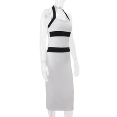 White dress with black stripes on a mannequin