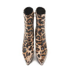 Pair of leopard print boots on a white background