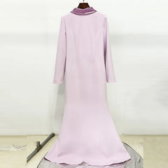 Light purple dress on a mannequin against a white background