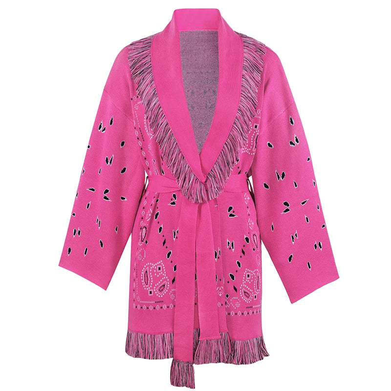 Pink cardigan with fringe details on a white background