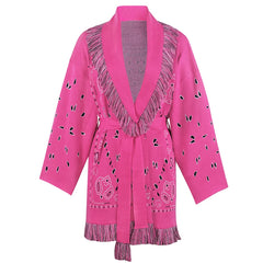 Pink cardigan with fringe details on a white background