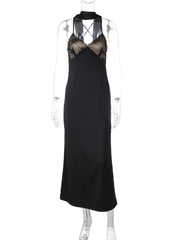 Black evening gown with intricate beaded neckline on a mannequin against a white background