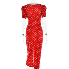 Red dress with white polka dots on a mannequin against a white background