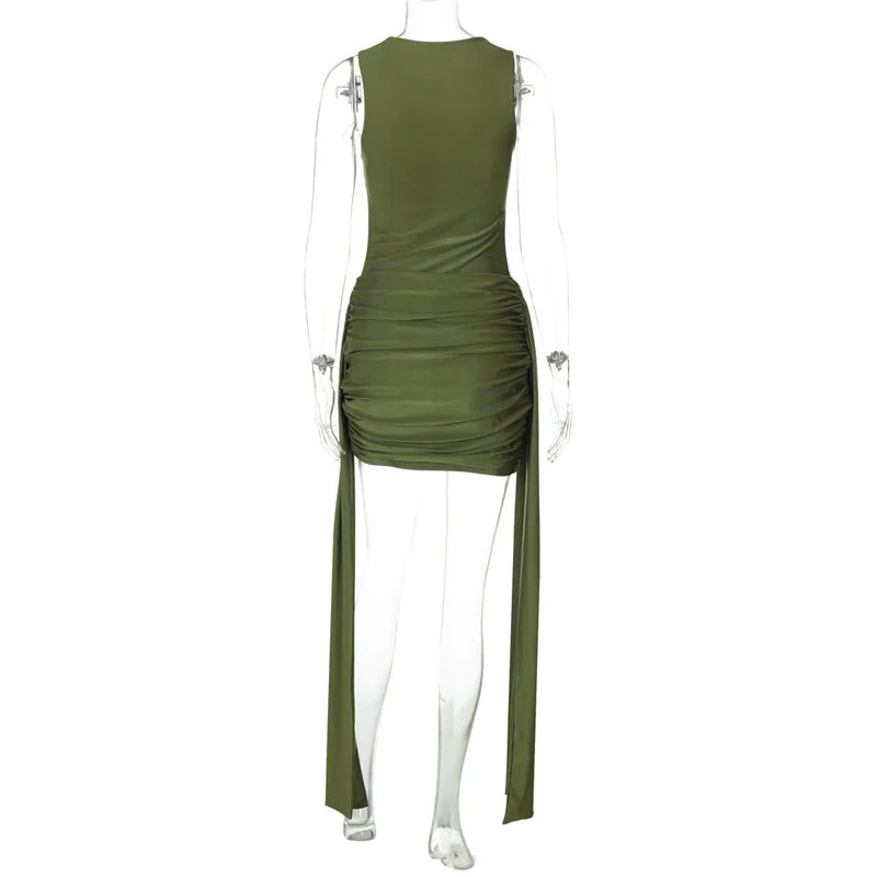 Green dress on a mannequin against a white background