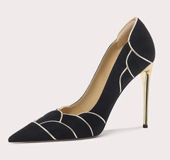 Black high-heeled shoe with geometric design on a light gray background