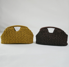 Two crocheted bags, one mustard yellow and one brown, on a white surface.