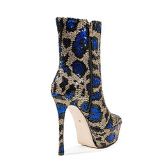 High-heeled boot with blue and gold pattern on a white background