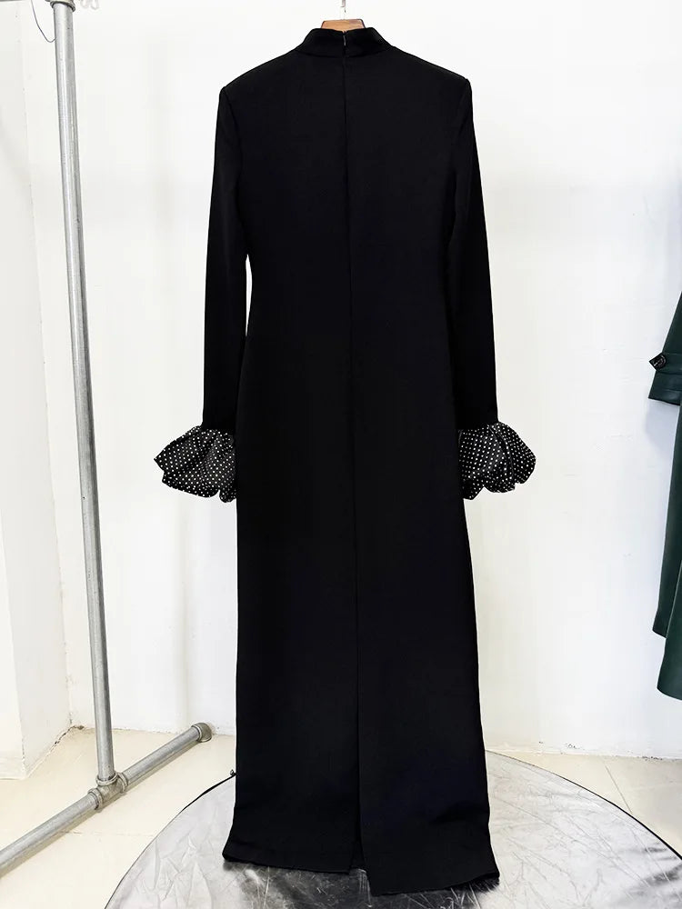 Back view of black high neck maxi dress with rhinestone puff sleeves