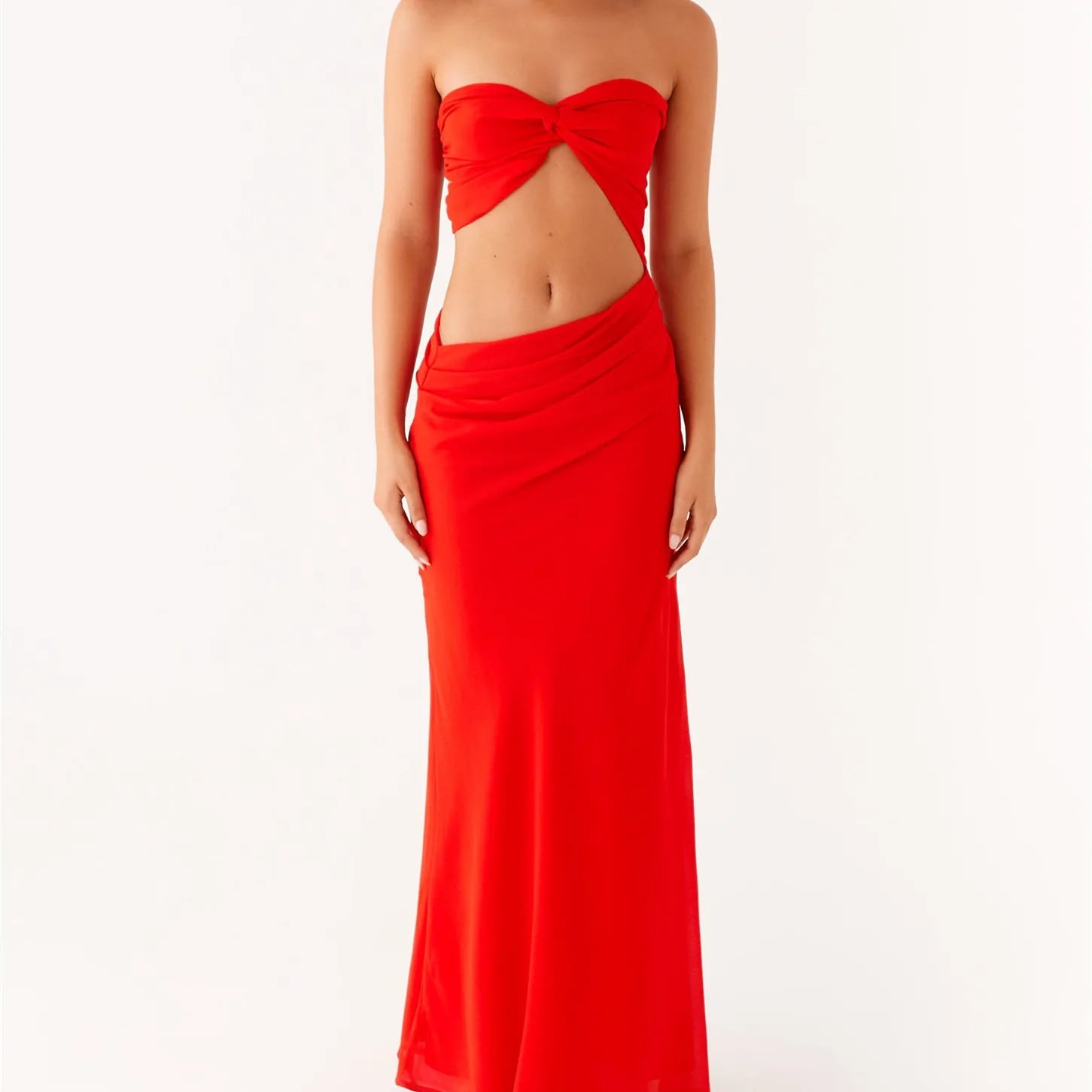 Red strapless gown with cut-out design on a white background