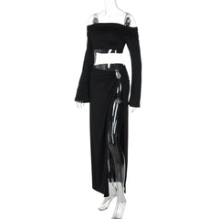 Black off-shoulder top and long skirt with sheer panels on a mannequin against a white background
