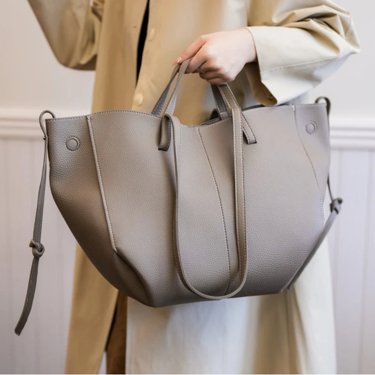 Front view of soft PU leather tote with ribbon detail