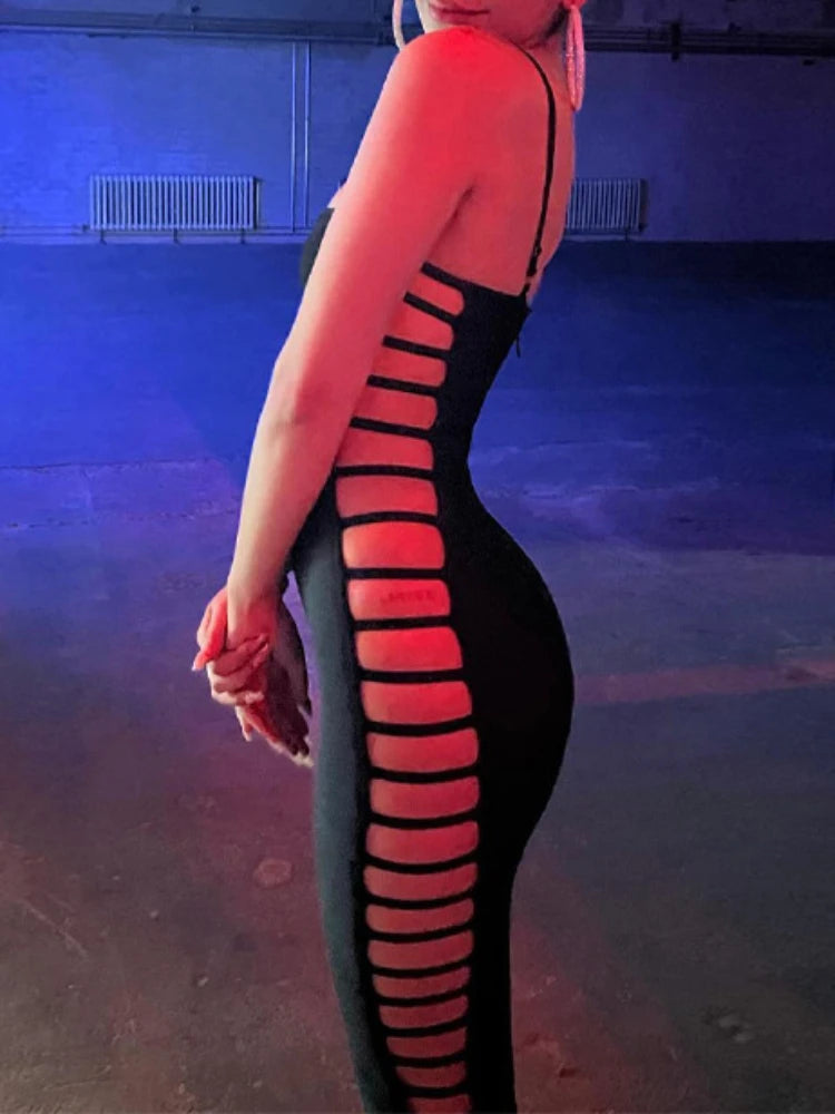 Person wearing a black and red striped garment against a blue background