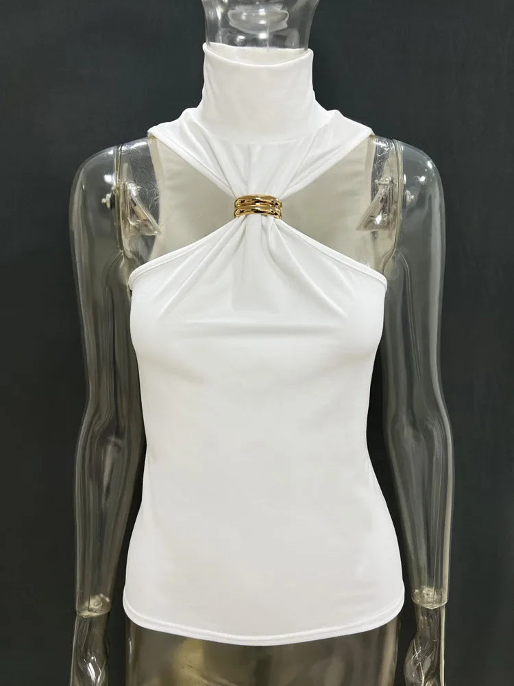 White top with gold detail on a transparent mannequin against a black background