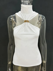 White top with gold detail on a transparent mannequin against a black background