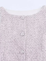 Close-up of a textured fabric with a subtle pattern on a light background