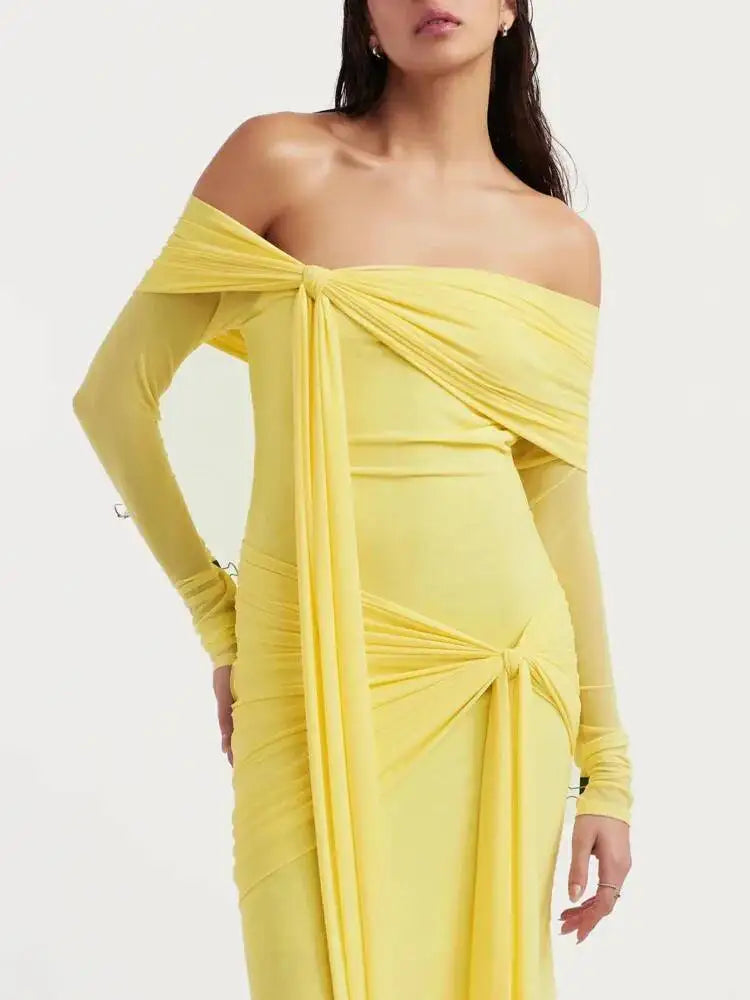 Close-up of the draped neckline on an off-shoulder gown dress