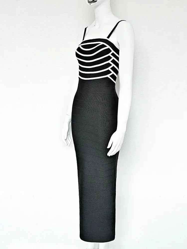 Black and white striped dress on a mannequin against a white background