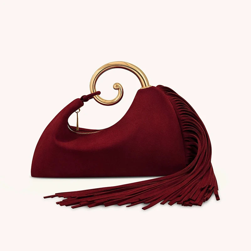 Red handbag with gold handle on a white background