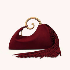 Red handbag with gold handle on a white background