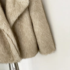 Close-up of beige faux fur fabric on a white background