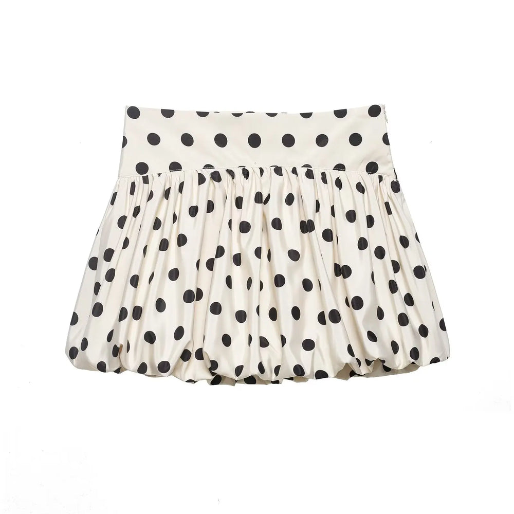 White skirt with black polka dots on a white background