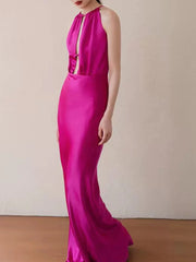 Fuchsia evening gown on a plain background