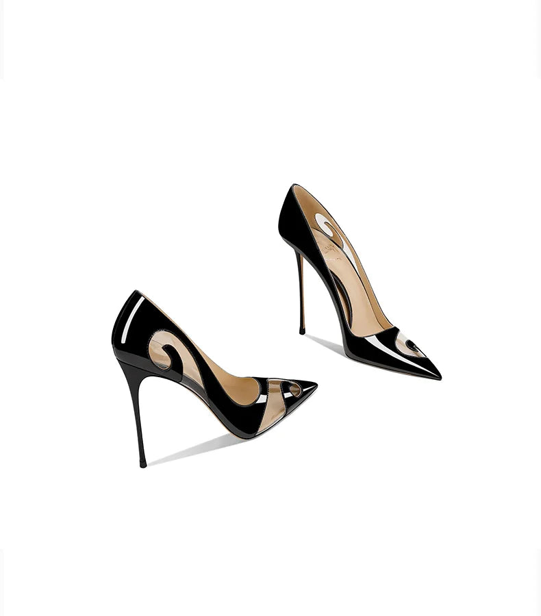 Black high-heeled shoes with a glossy finish on a white background