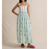 Maxi dress with floral print bodice, green striped skirt, and tie shoulder straps