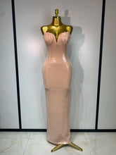 Strapless V-neck sequin column maxi dress on a mannequin