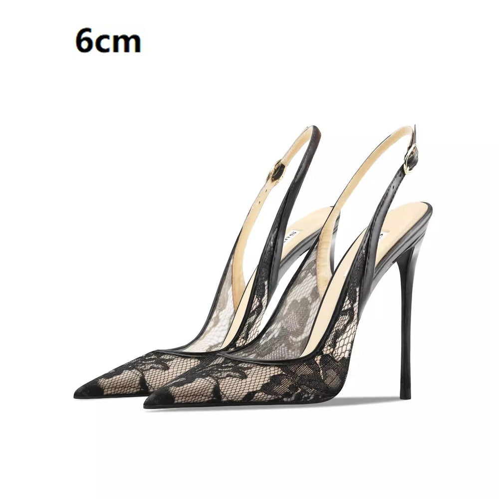 Black lace high-heeled shoes with thin straps on a white background