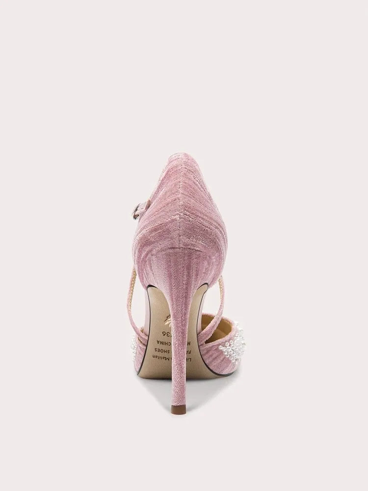 Pink high-heeled shoe with a strap on a white background