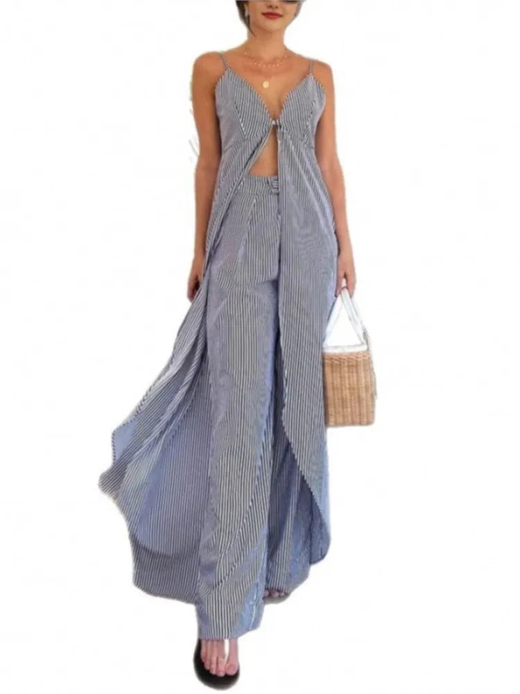 Woman wearing a blue and white patterned dress with a white background