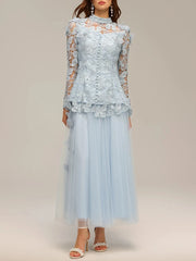 Light blue lace dress with long sleeves on a plain background