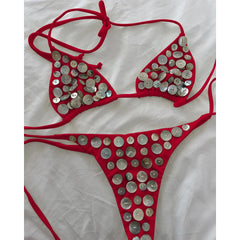 Red bikini set with circular iridescent button embellishments.