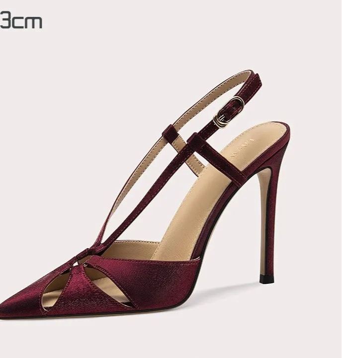 Maroon high-heeled sandal on a light gray background