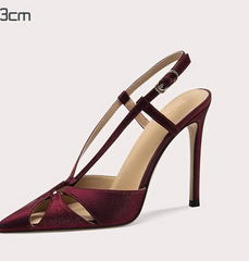 Maroon high-heeled sandal on a light gray background