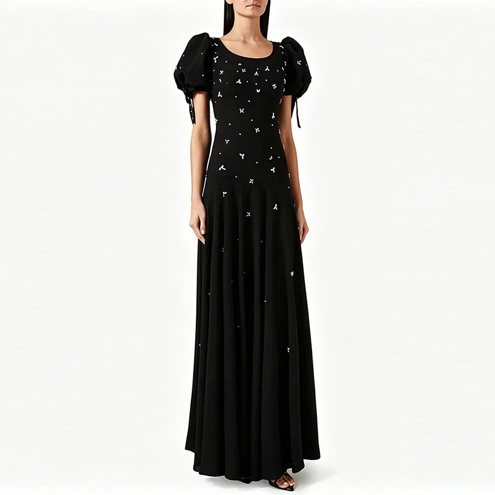 Puff sleeve embellished maxi dress on a model