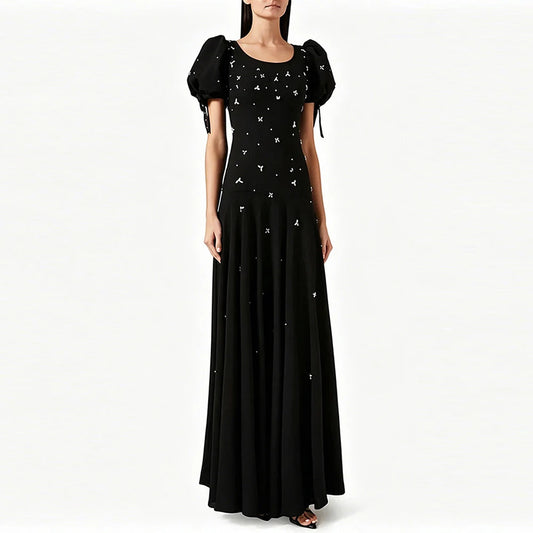 Puff sleeve embellished maxi dress on a model