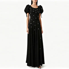 Puff sleeve embellished maxi dress on a model