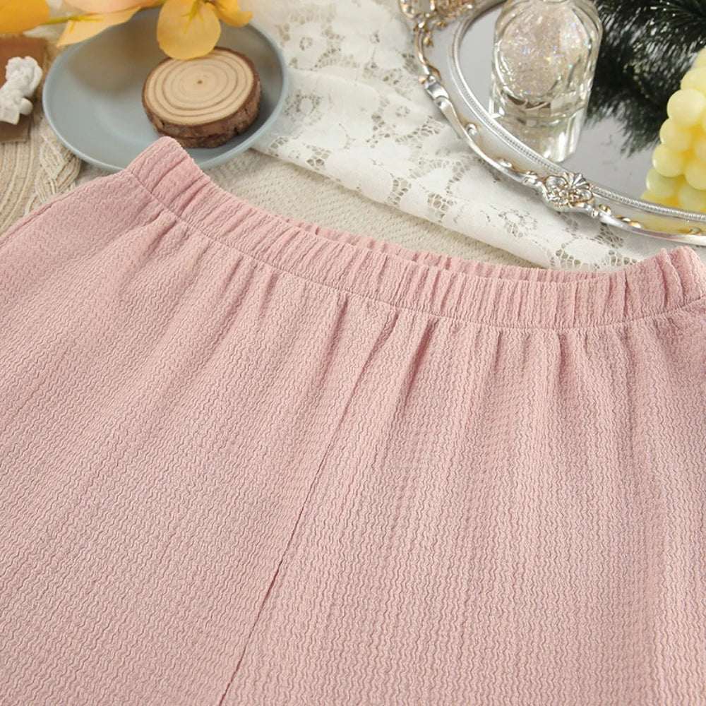 Close-up of a pink textured fabric with a blurred background