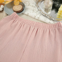 Close-up of a pink textured fabric with a blurred background