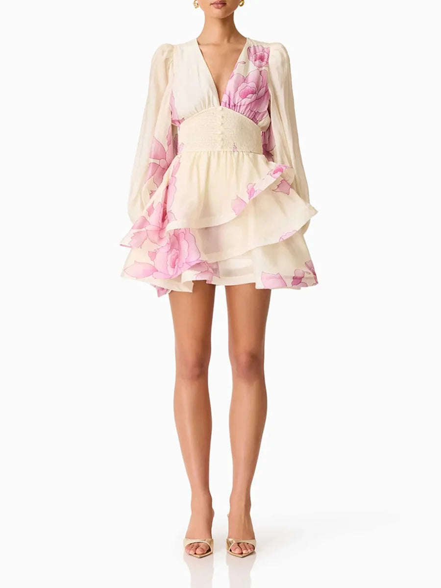 Front view of a floral print v-neck mini dress with long sleeves.