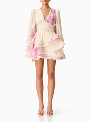 Front view of a floral print v-neck mini dress with long sleeves.