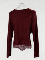 Maroon long-sleeve top with lace hem on a white background